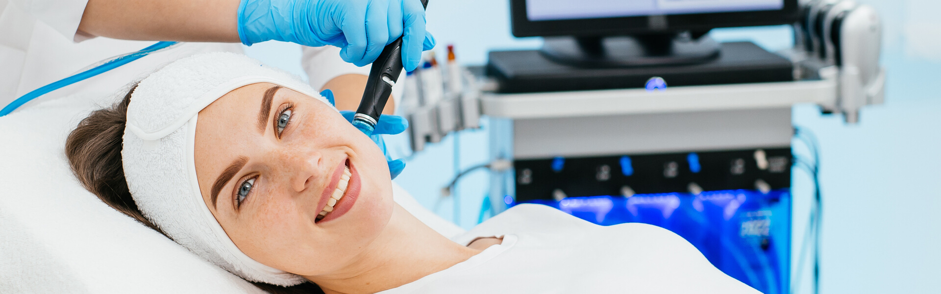 Woman receiving a professional Hydroderm Facial treatment at Embrace Eternal Beauty in Hot Springs, AR