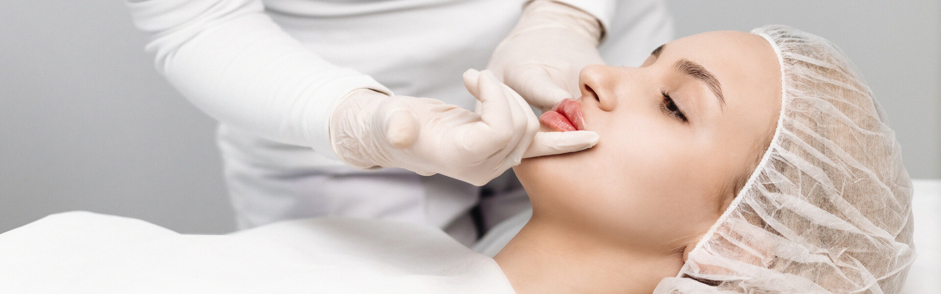 Patient receiving professional skin analysis during a medical skin consultation.