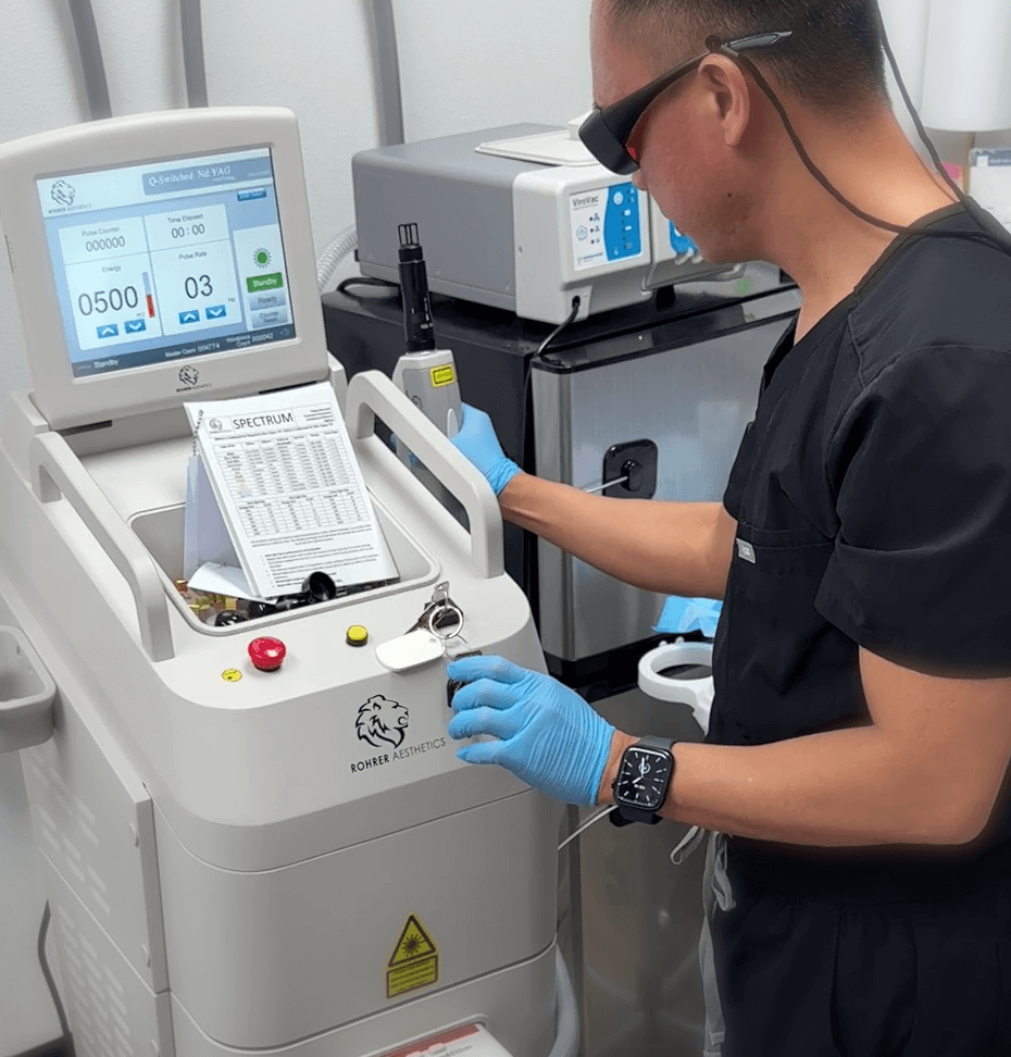Dr. John Mark Pabona operating the Spectrum Q-switched laser at Embrace Eternal Beauty in Hot Springs